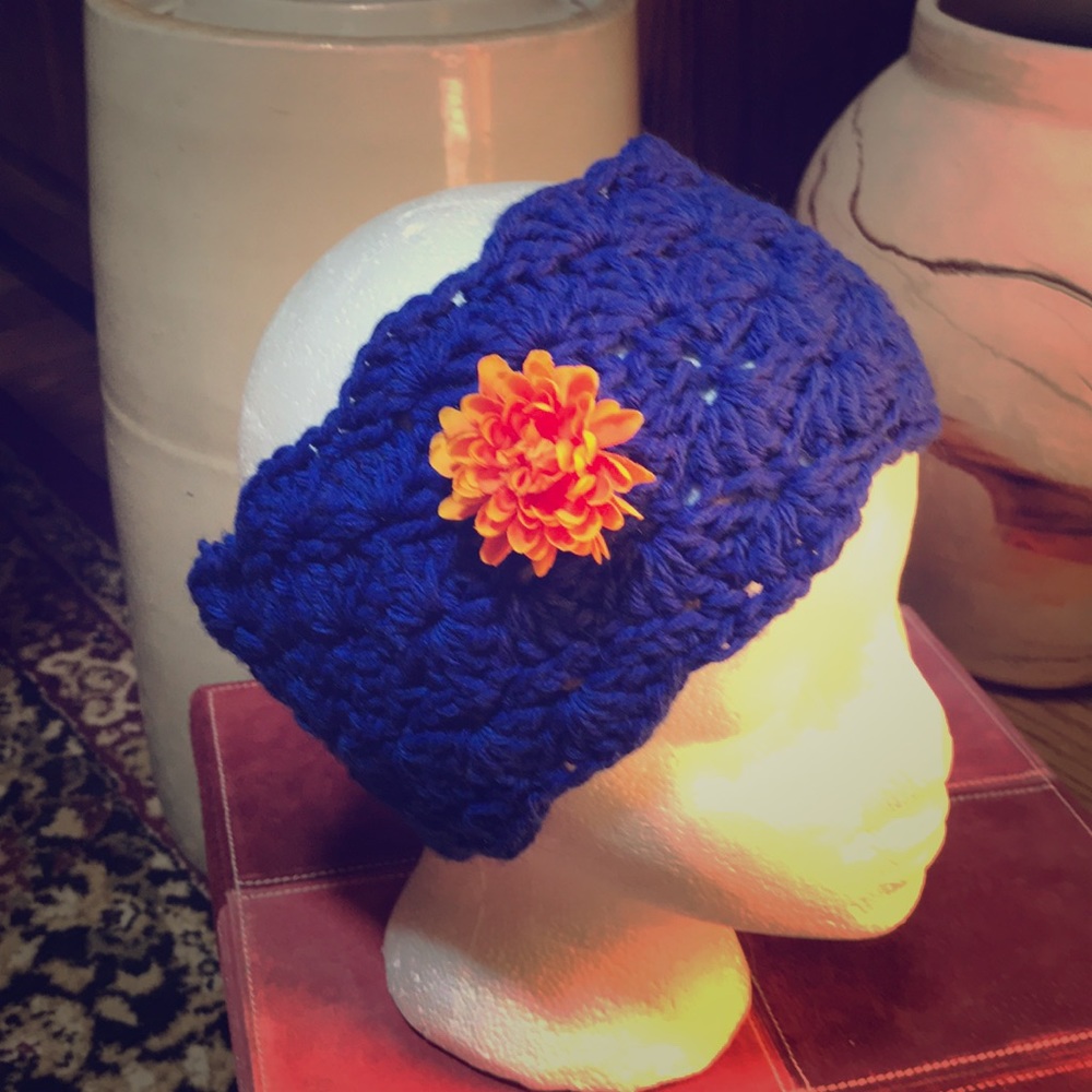 Handmade crocheted headband with flower decoration